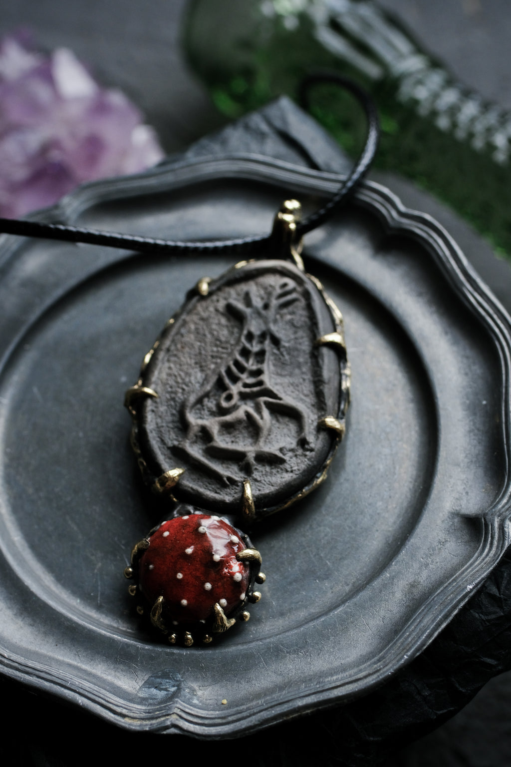 Brass pendant with ceramic cabochons