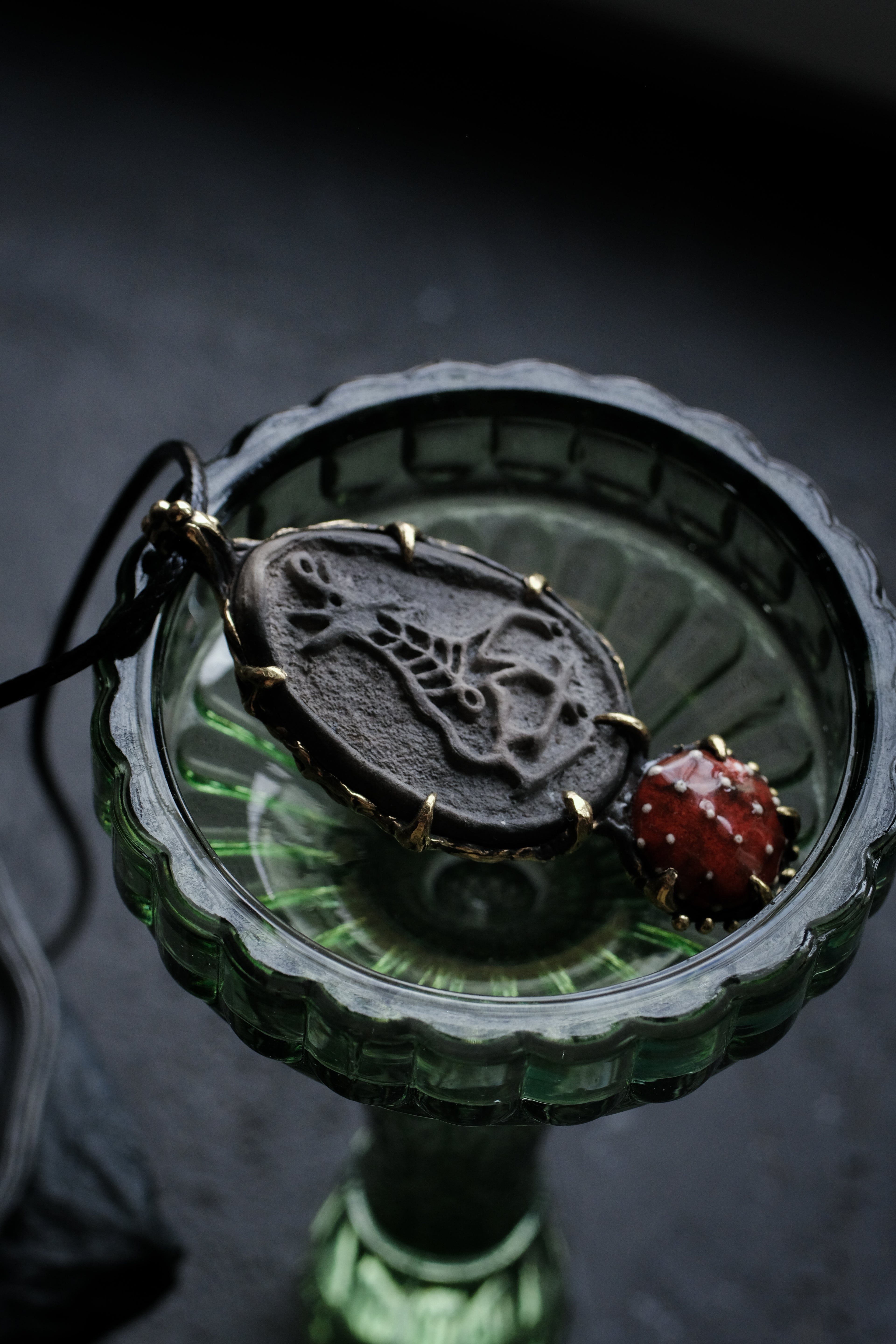 Brass pendant with ceramic cabochons