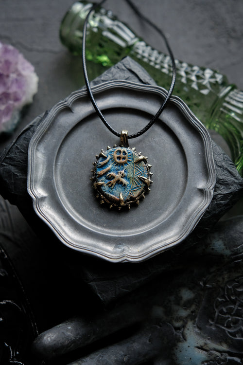 Brass pendant with owl ceramic cabochon