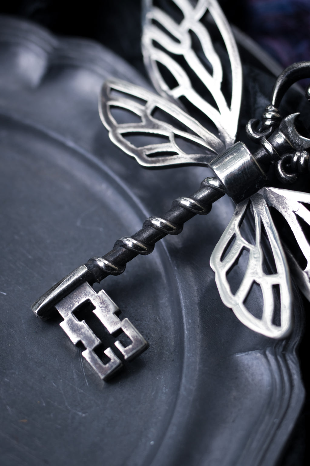 Winged key pendant
