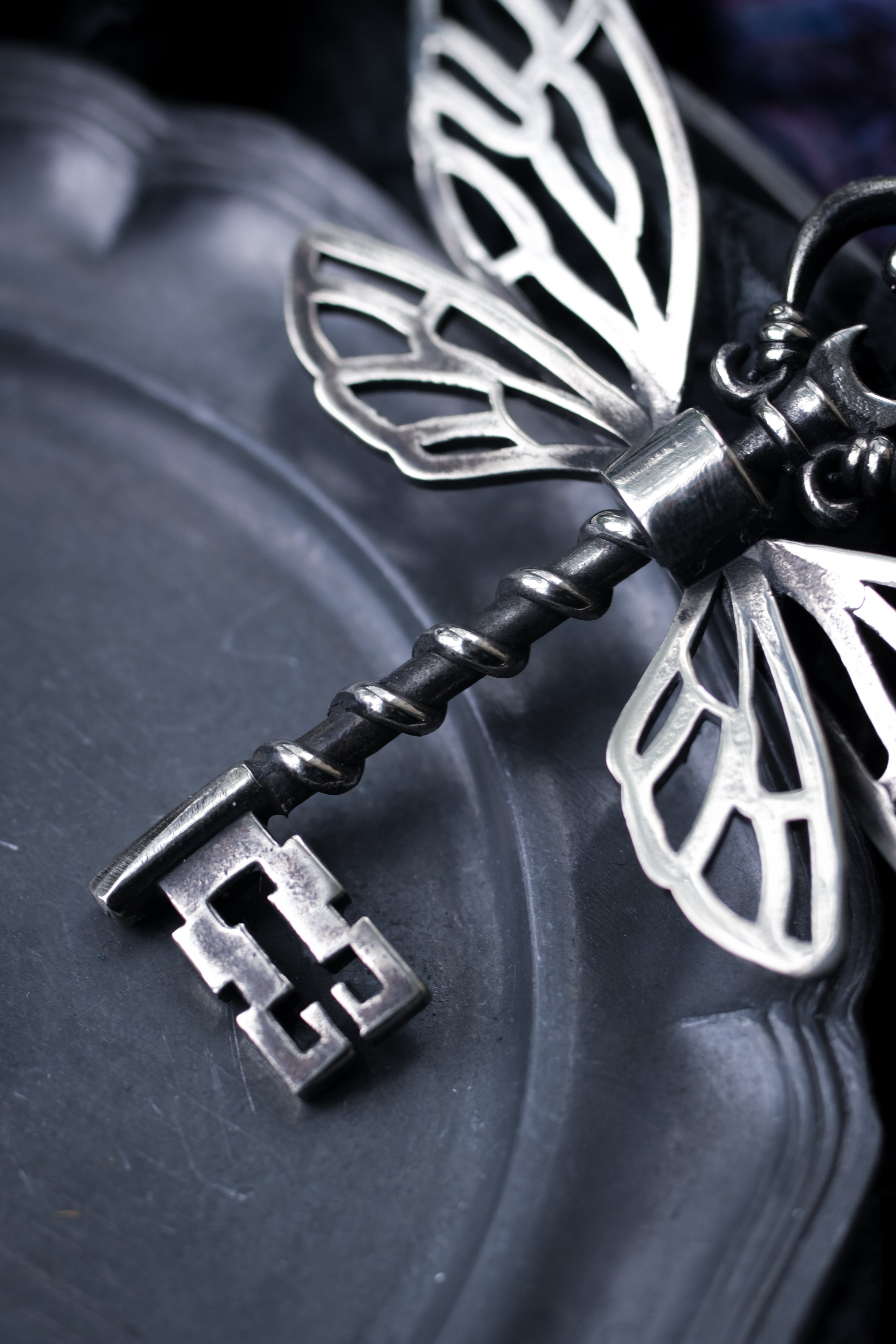 Winged key pendant