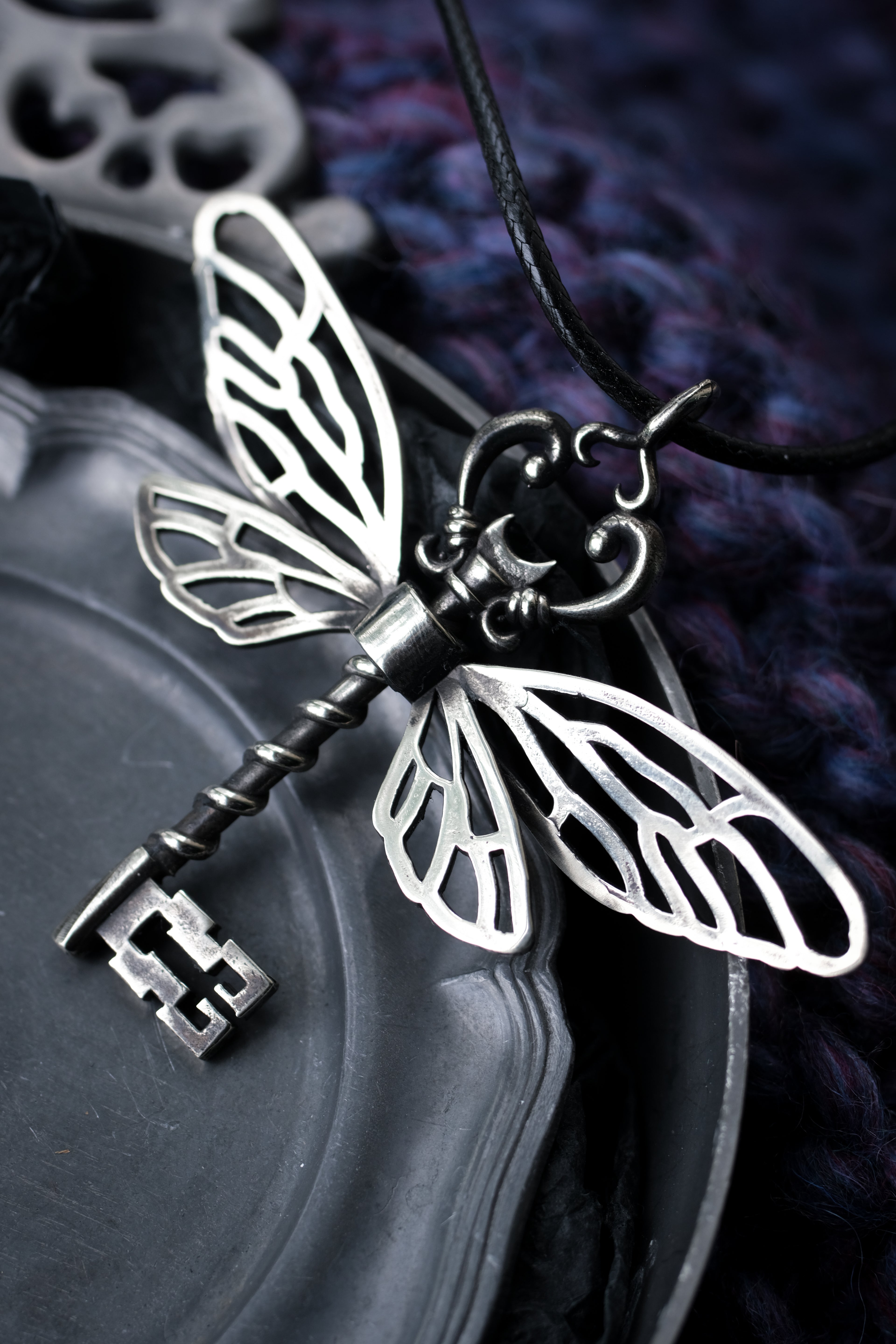 Winged key pendant