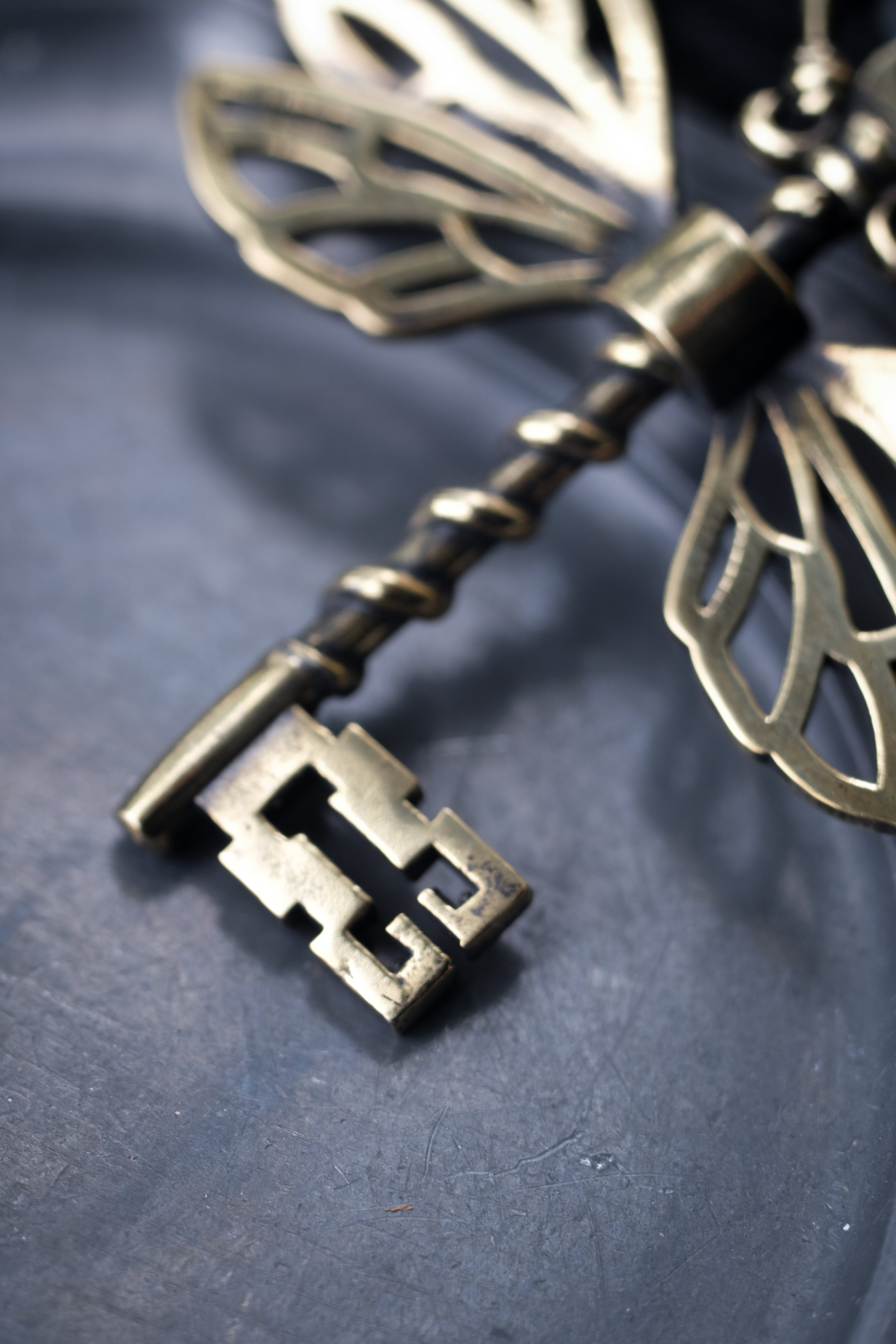 Winged key pendant