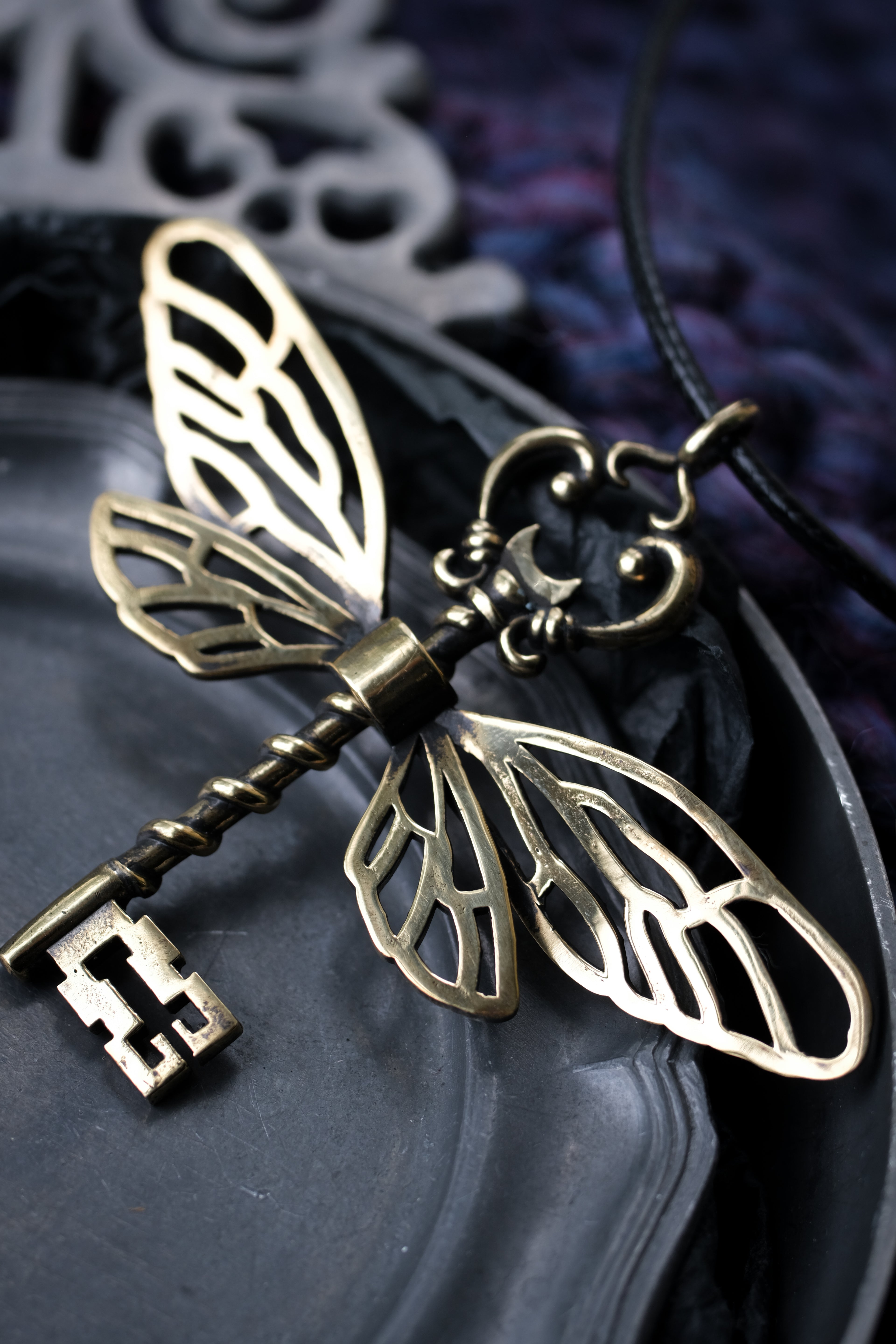 Winged key pendant