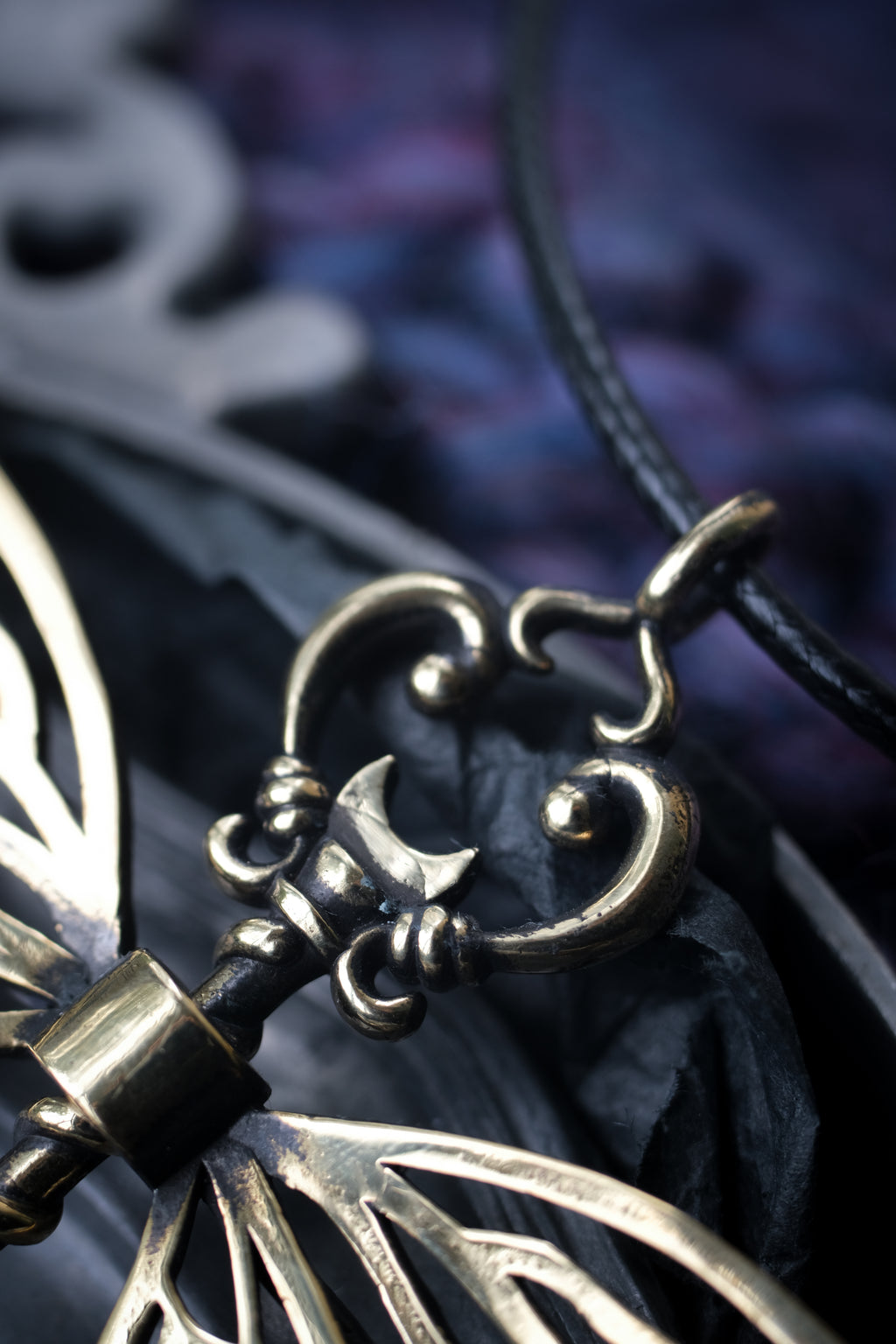 Winged key pendant