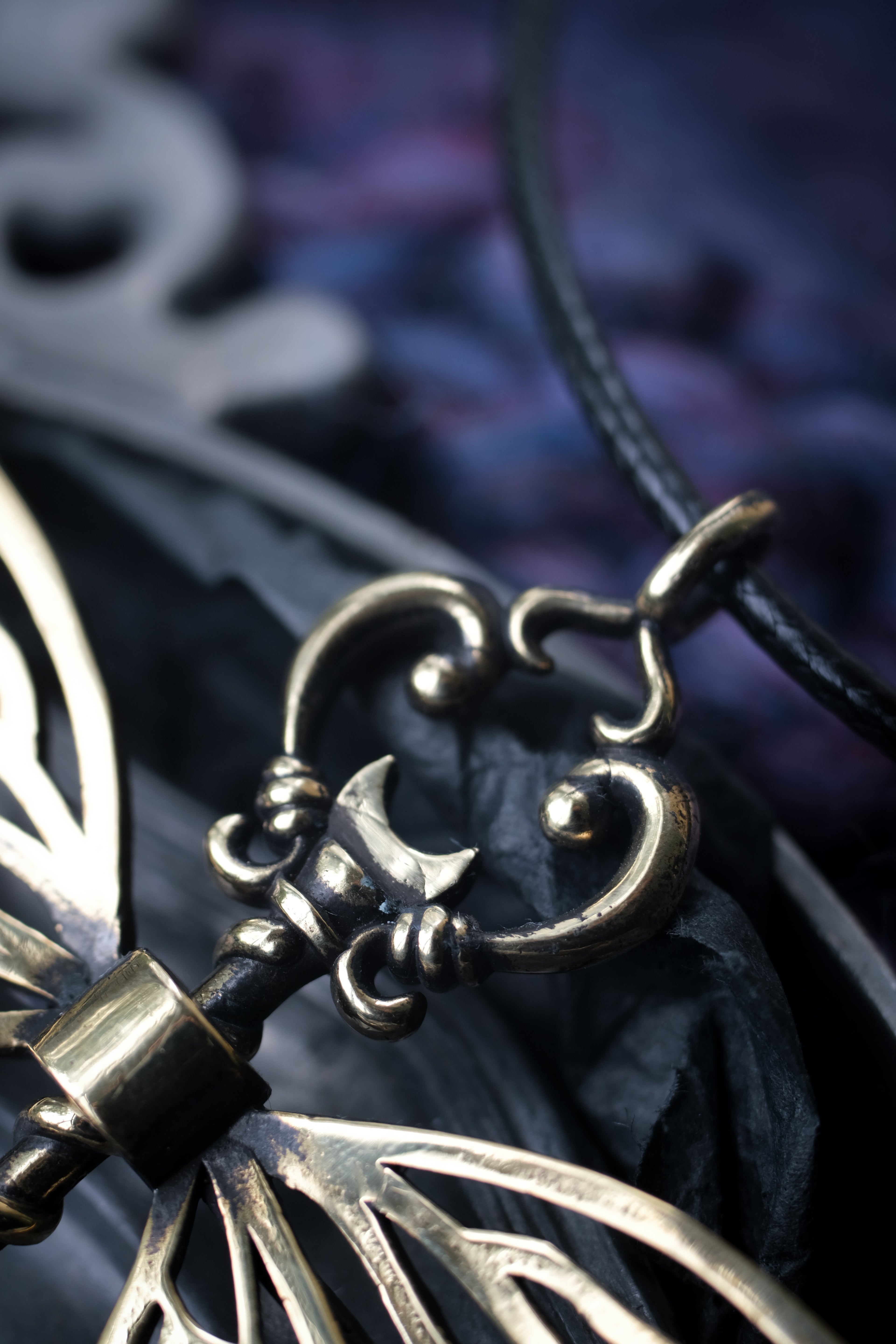 Winged key pendant