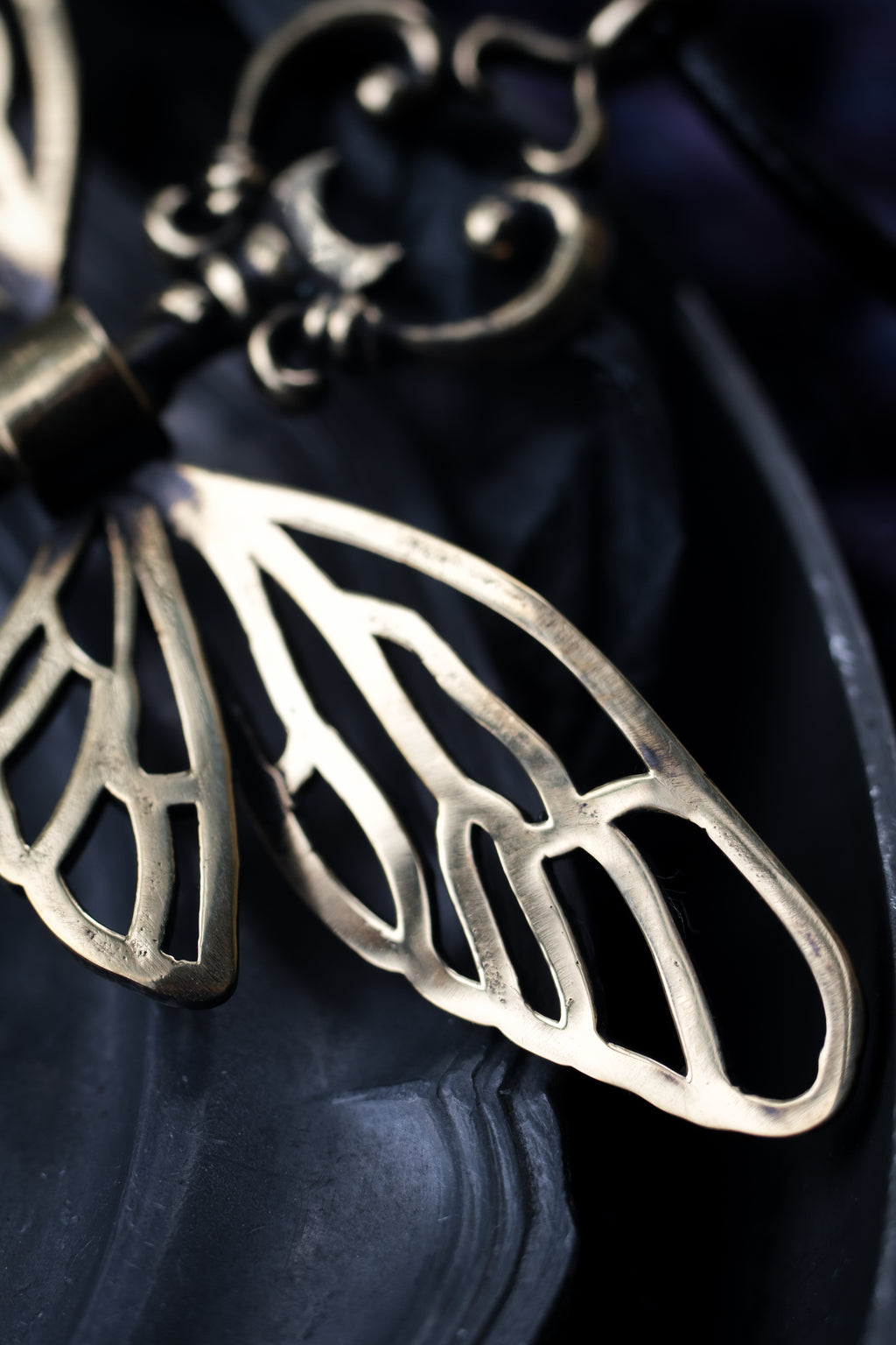 Winged key pendant
