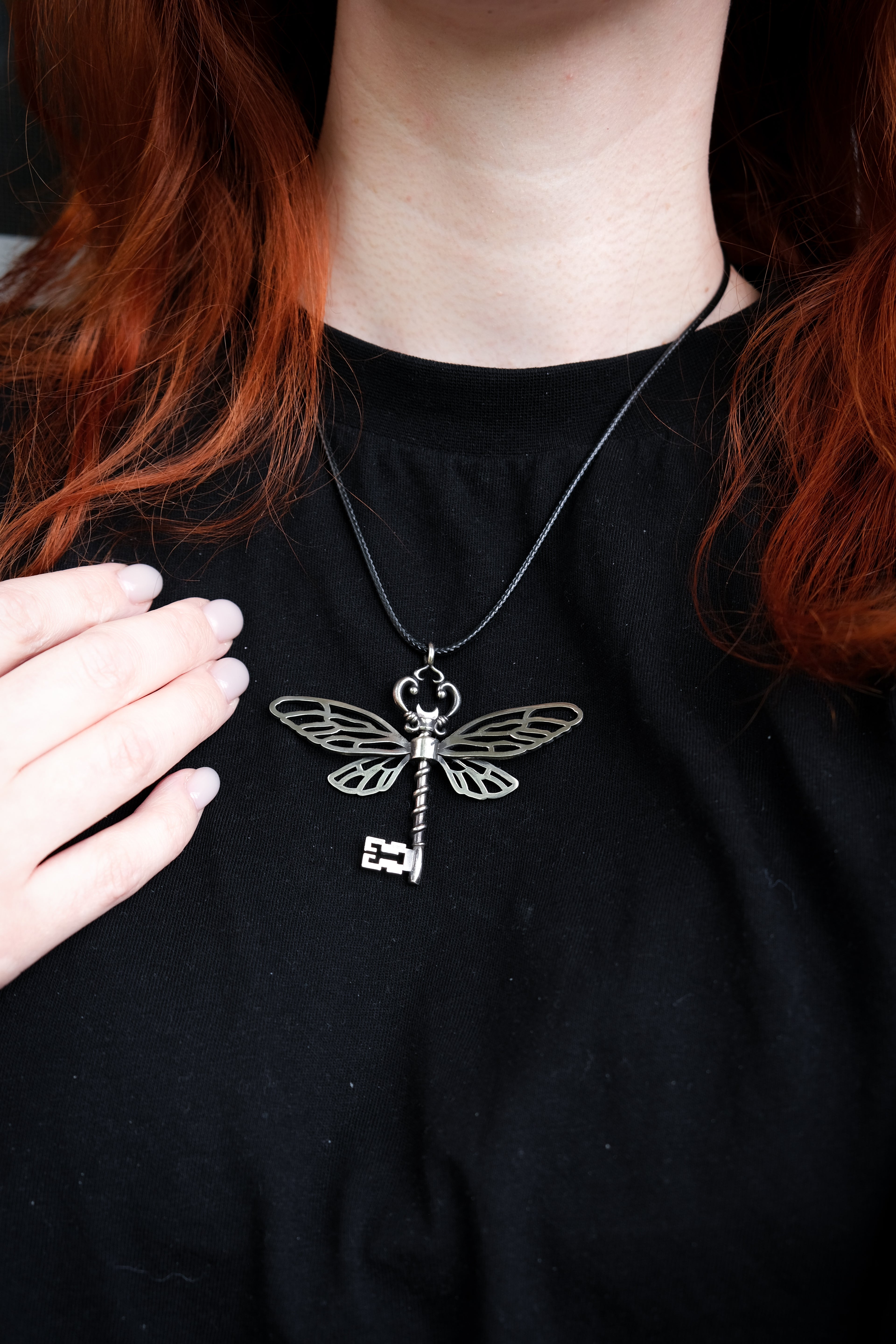 Winged key pendant