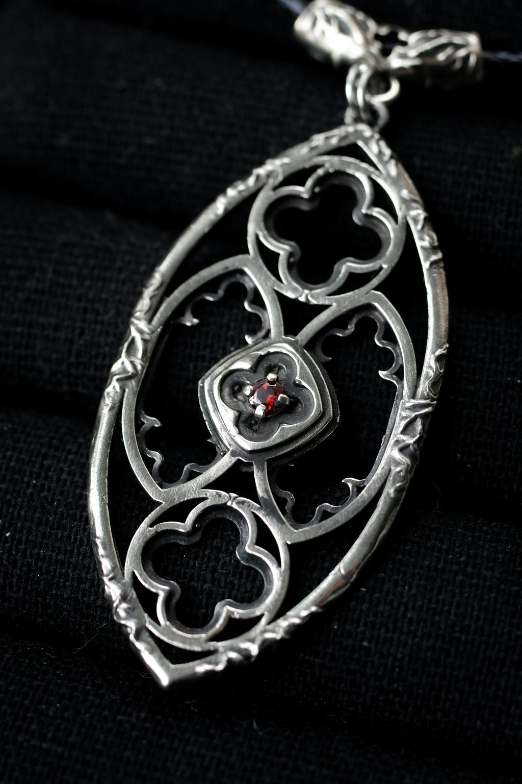 Gothic window pendant with garnet