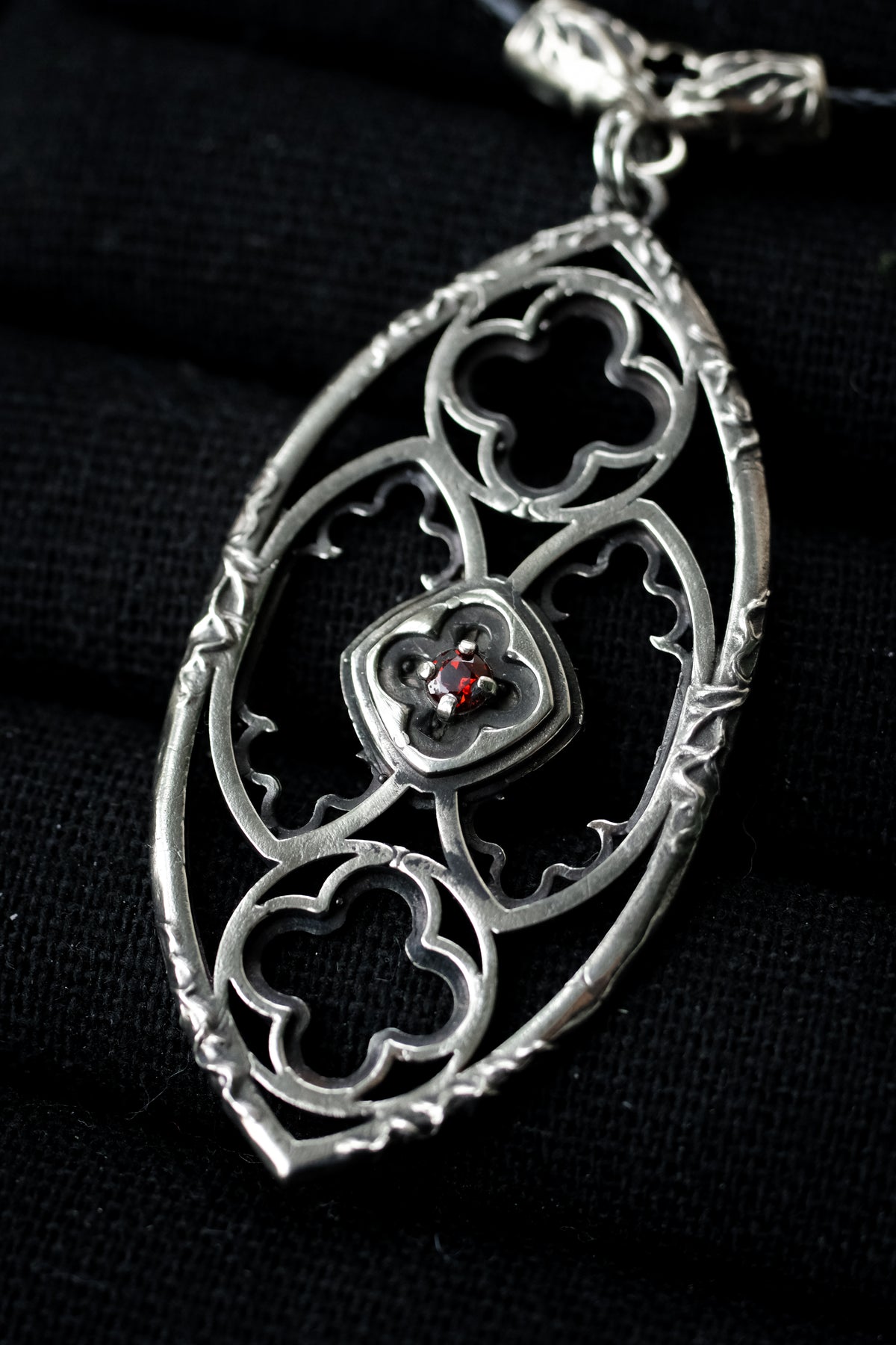 Gothic window pendant with garnet