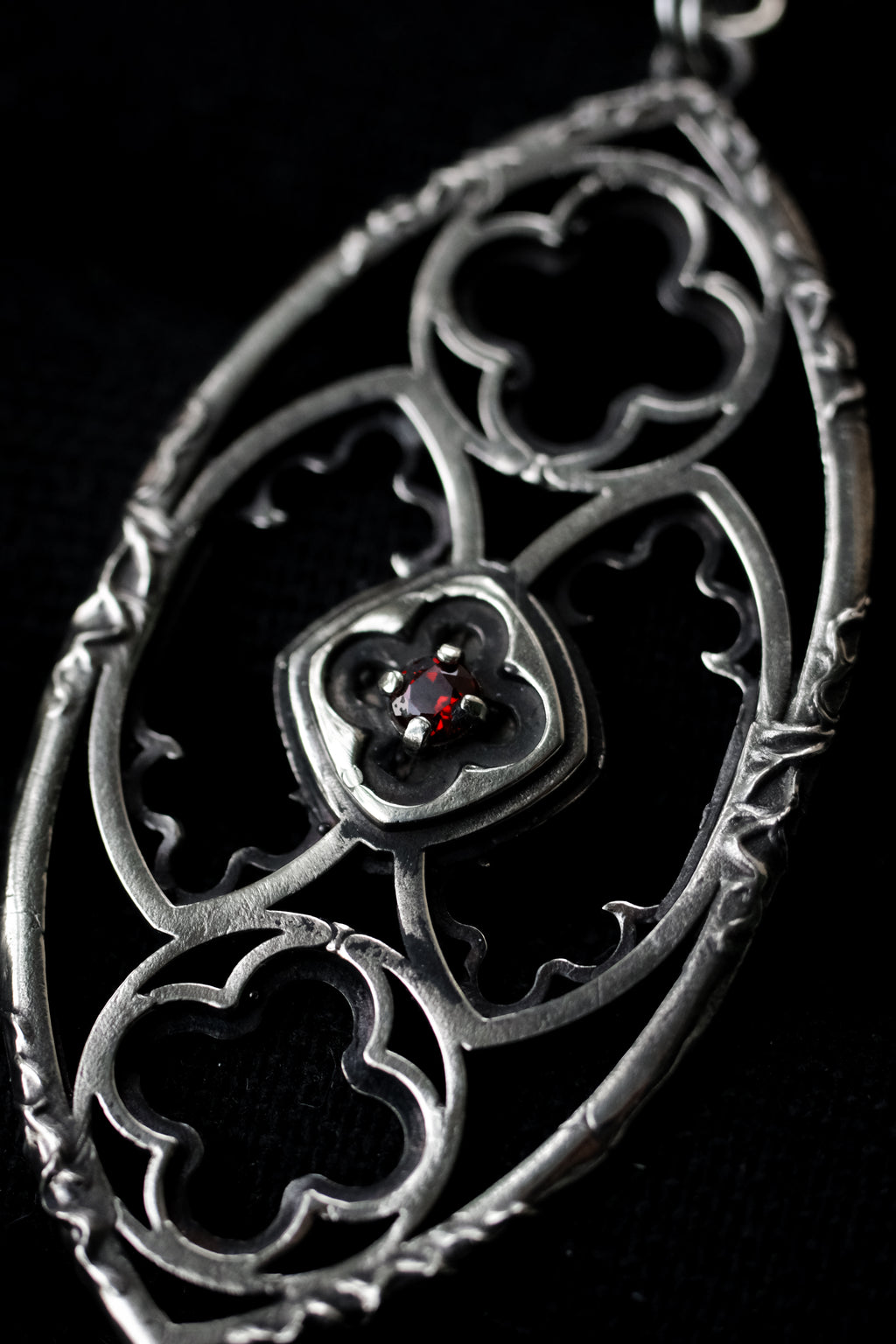 Gothic window pendant with garnet