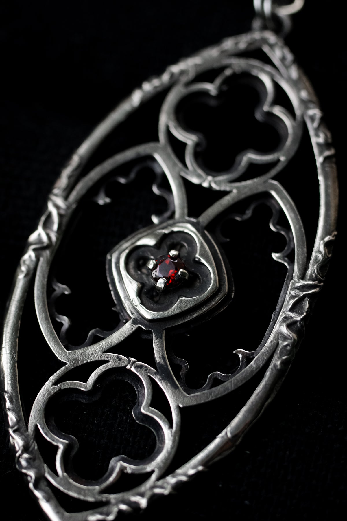 Gothic window pendant with garnet