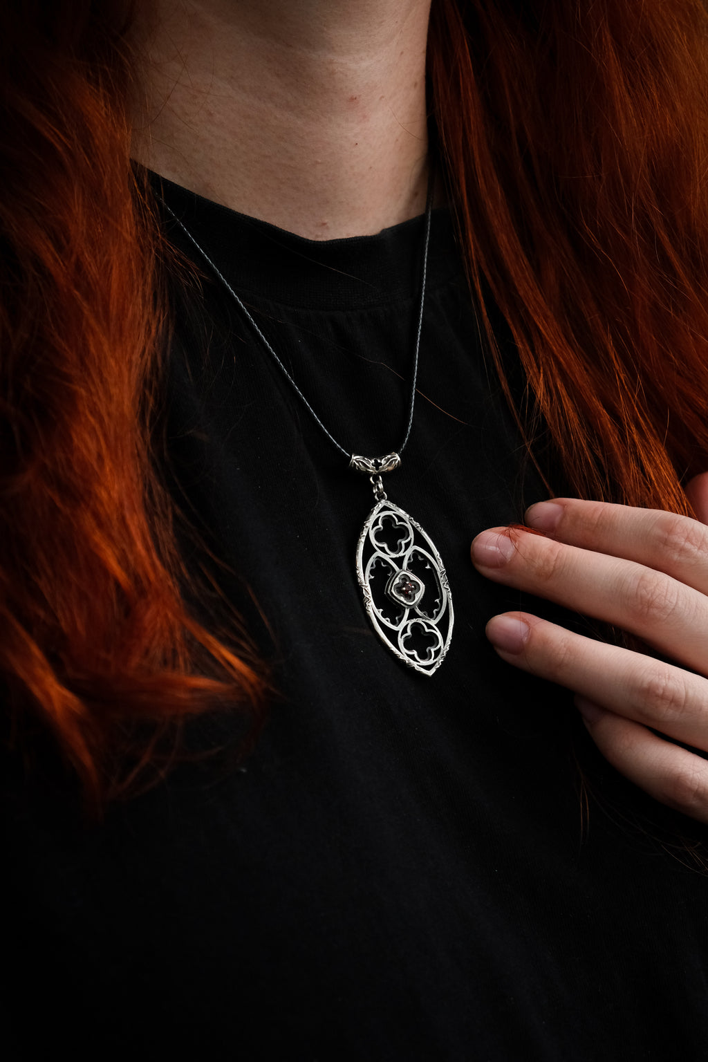 Gothic window pendant with garnet
